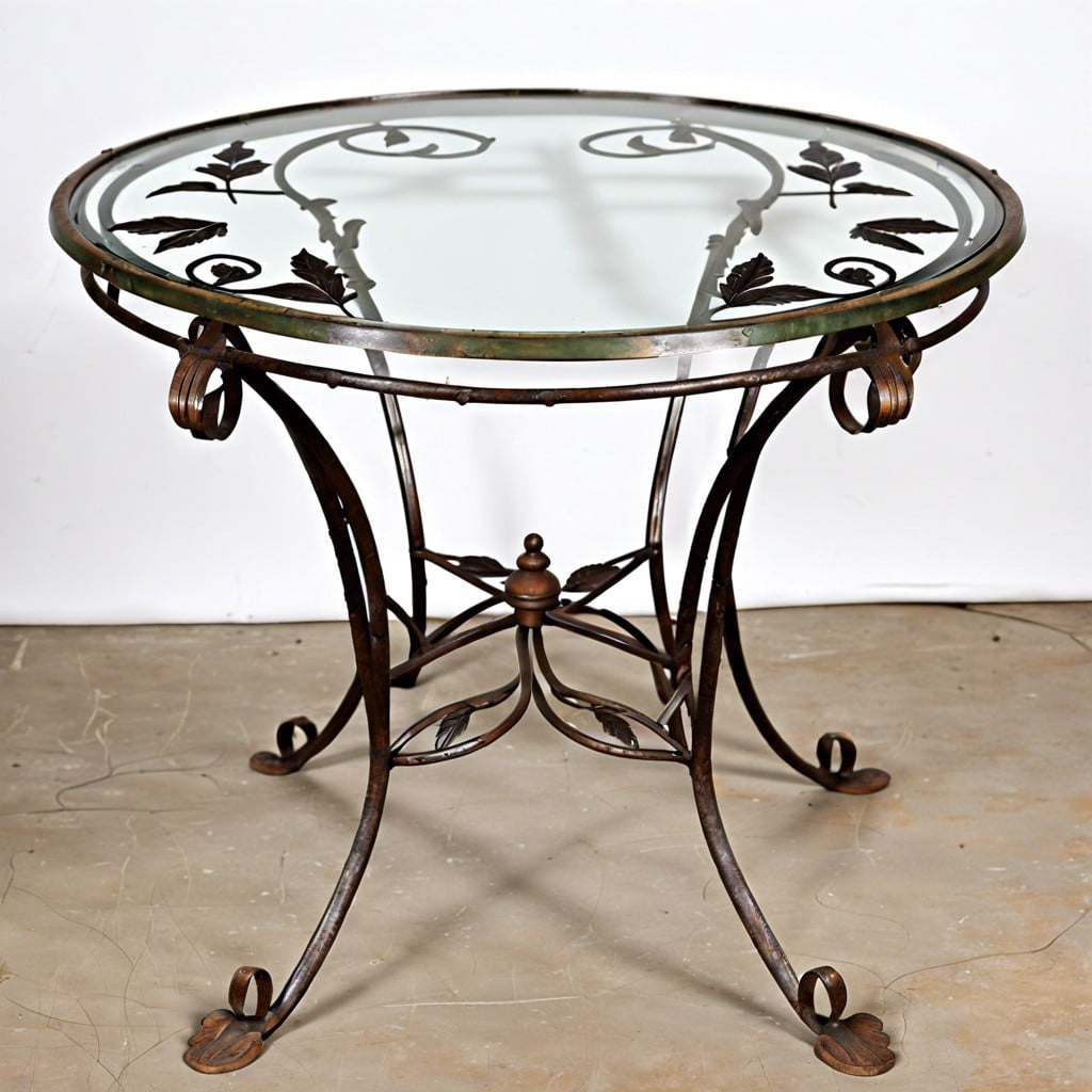 vintage french cafe table with vine leaf ironwork and glass top
